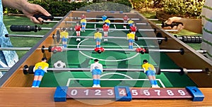 Kicker game players have fun for playing table football soccer, Soccer table game