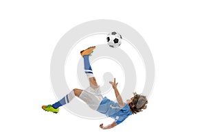 Little boy, football soccer player in action, motion training isolated on white studio background. Concept of sport