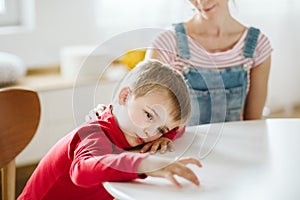 Kid with ADHD don`t paying attention to his mother