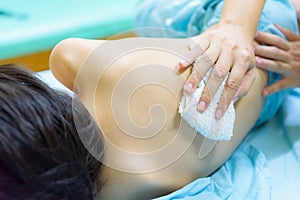 The Kid admitted at hospital. Mother rub the body with wet cloth photo