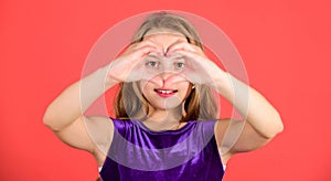 Kid adorable girl with long hair smiling face show heart gesture to you. Celebrate valentines day. Love and sympathy