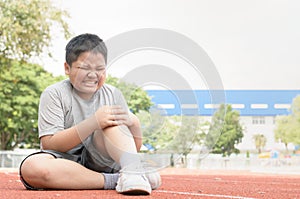 Kid athlete suffering form running knee or kneecap injury