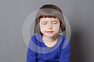 Kid attitude concept for pouting 4-year old child