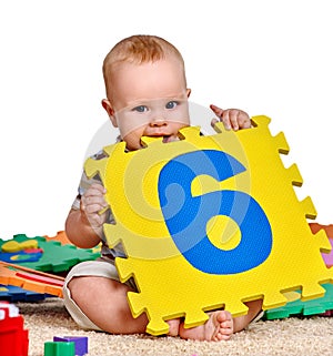 Kid baby boy plying with puzzle toy