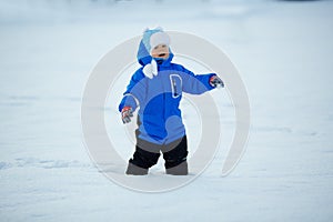 Kid on background of winter landscape. A child in the snow. Sce