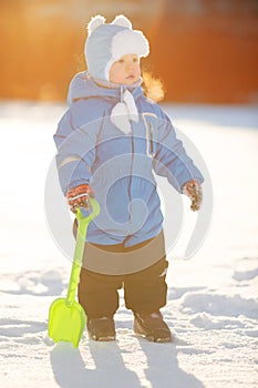 Kid on background of winter landscape. A child in the snow. Sce