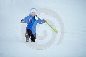 Kid on background of winter landscape. A child in the snow. Sce
