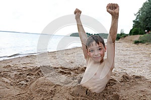 Kid on beach of Lake Seliger