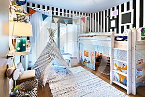 Kid bedroom with teepee and bunk bed.