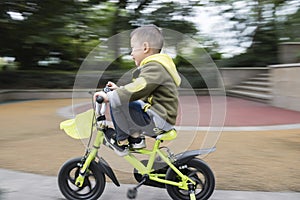 kid on bicycle gliding