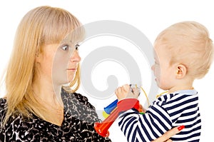 Kid blowing on mother in football beep photo