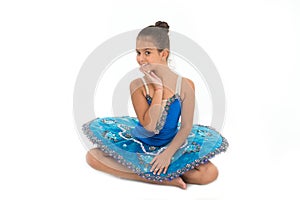 Kid blue dress with ballet skirt white background isolated. Child flexible pupil practice dancing. Child tender dancer