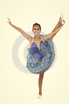 Kid blue dress with ballet skirt white background isolated. Child flexible pupil practice dancing. Dream of every girl