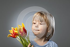 Kid with a bouquet of tulips