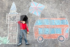 Kid boy in british soldier uniform with London chalks picture