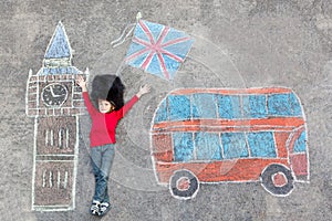 Kid boy in british soldier uniform with London chalks picture