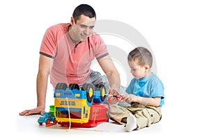 Kid boy and his dad repair toy trunk