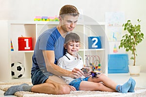 Kid boy holding a radio remote control for