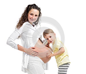 Kid boy listening with can pregnant mother's belly