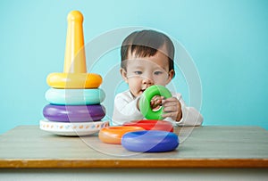 Kid boy playing with building blocks at home or kindergarten