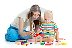 Kid boy playing toys together mother