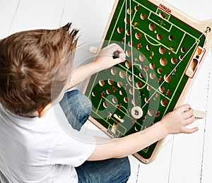 Kid boy plays educational game interestedly develop coordination