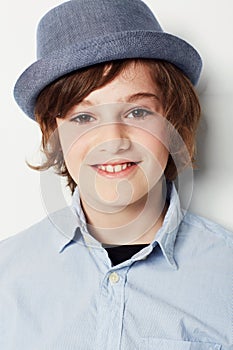 Kid, boy and portrait for fashion in studio, cool clothes and confidence by white background. Happy male person, child