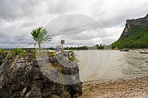 Kid boy standing on the rocks at Khao Ta Mong Lai Forest Park,Prachuap Khiri Khan