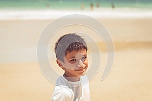 Kid boy ten years old by the beach enjoying the sunshine at Maracas Bay Trinidad and Tobago