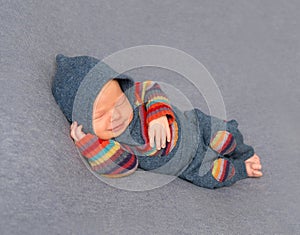 Kid in a bright outfit, sleeping