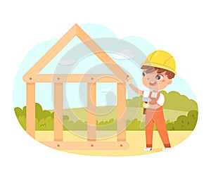 Kid builder working on timber frame house, carpentry, cute worker boy holding hammer