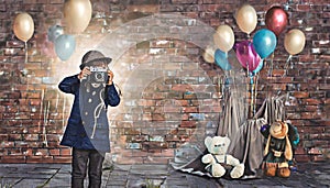 kid with camera with brick background