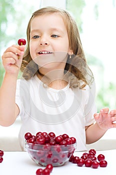 Kid with cherry berries