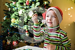 Kid child boy making by hands x-mas decorations