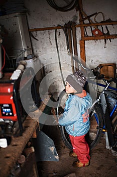 Kid in cluttered storage room