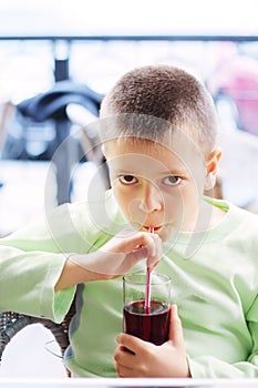 Kid with cold drink