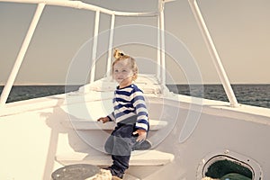 Kid concept. Little kid travel on ship. Kid enjoy sea travelling. Kid on board. Summer vacation and wanderlust