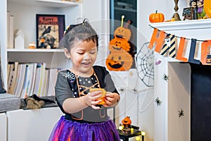 Kid costume for Halloween festival at home. Family celebration and decorated room