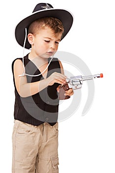 Kid, cowboy hat and revolver gun in studio isolated on a white background mockup space. Child, toy pistol and play in