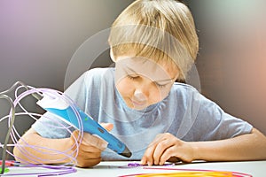 Kid creating with 3d printing pens