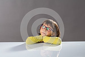 Kid critical thinking with serious little child and gifted thoughts photo