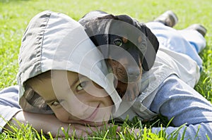 Kid and dachshund puppy