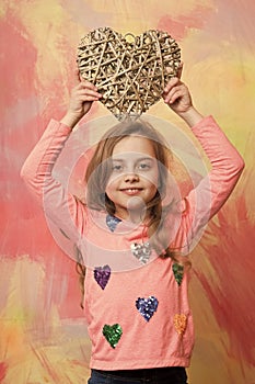 Kid with decorative love heart.