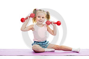 Kid doing exercises with dumbbells