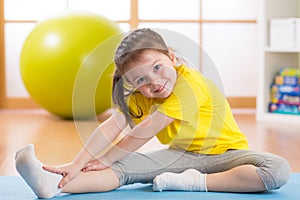 Kid doing fitness exercises