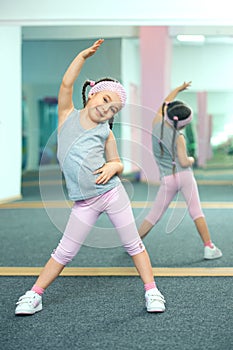 Kid doing fitness exercises