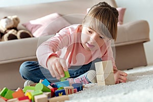 Kid with down syndrome playing