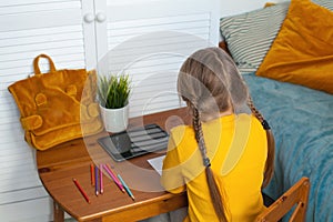 Kid drawing. Distance learning, hobby and leisure activity at home concept