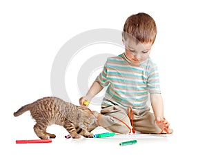 Kid drawing felt pens with cat