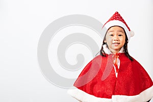 Kid dressed in Santa Claus hat the concept of holiday Christmas Xmas day